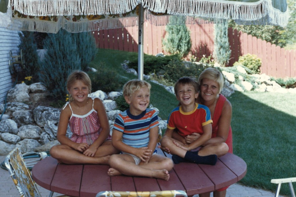 Family gathered on a patio table in the backyard
