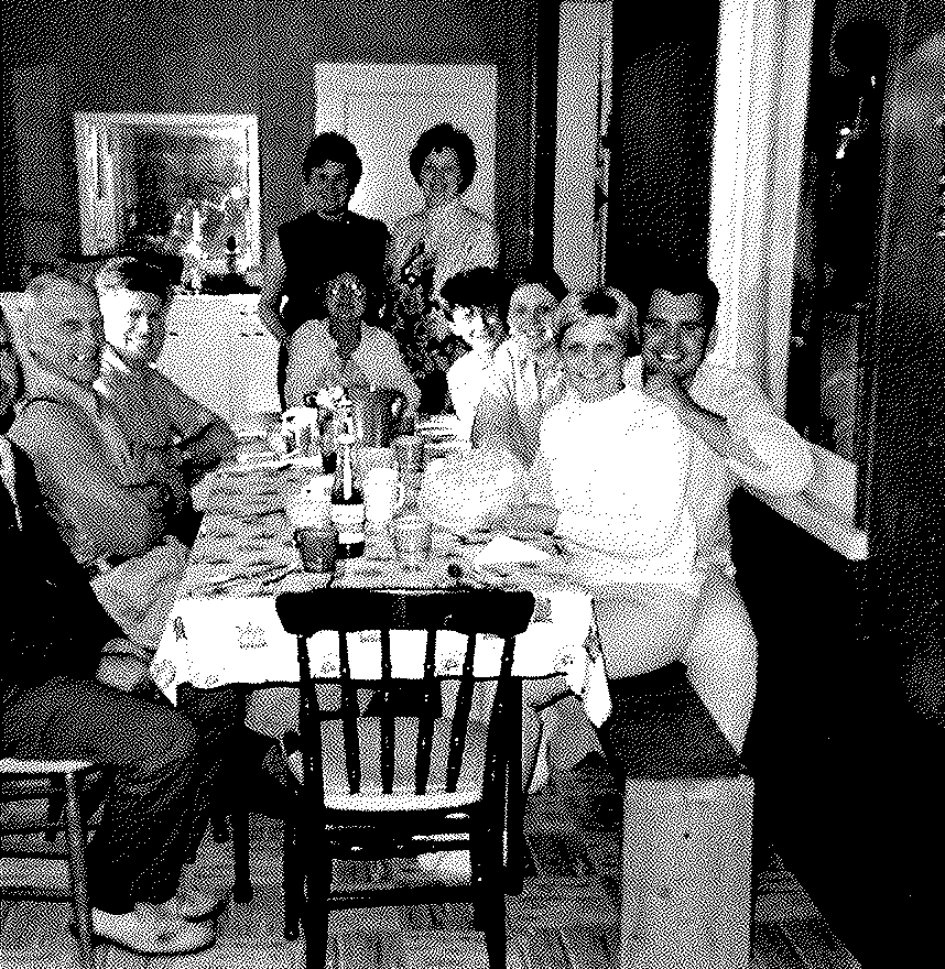 Family and friends gathered around the dinner table