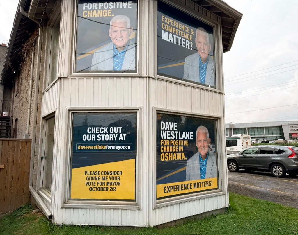 Close view of Dave Westlake for Mayor window signs at the campaign office