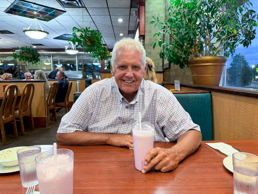 Dave Westlake enjoying a strawberry milkshake at Teddy's after campaigning