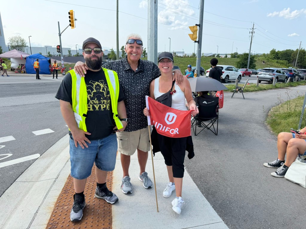 Dave Westlake with Unifor picketers on a crosswalk during the Ajax and Pickering casino strike